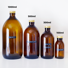 Load image into Gallery viewer, Amber Glass Or Plastic Bottle With Stamped Label & Gold Metal Screw Lid