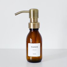 Load image into Gallery viewer, Amber Glass Or Plastic Dispenser Bottle With Personalised Label & Light Brushed Gold Metal Pump