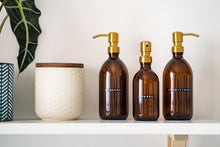 Load image into Gallery viewer, Amber Glass Or Plastic Dispenser Bottle With Stamped Personalised Label And Gold Metal Pump