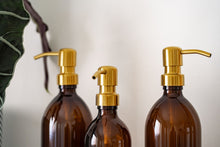 Load image into Gallery viewer, Amber Glass Or Plastic Dispenser Bottle With Stamped Personalised Label And Gold Metal Pump