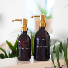 Load image into Gallery viewer, Amber Glass Or Plastic Dispenser Bottle With Stamped Personalised Label And Gold Metal Pump