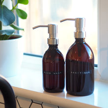 Load image into Gallery viewer, Amber Glass Or Plastic Dispenser Bottle With Stamped Personalised Label And Silver Metal Pump