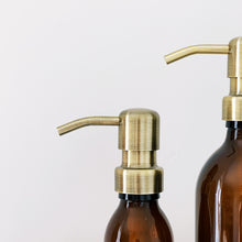 Load image into Gallery viewer, Amber Glass Or Plastic Dispenser Bottle With Light Brushed Gold Metal Pump