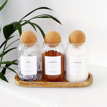 Load image into Gallery viewer, Three glass containers labeled 'Tea', 'Coffee', and 'Sugar' with cork lids on a wooden tray.