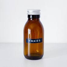 Load image into Gallery viewer, Amber Glass Or Plastic Bottle With Stamped Label & Silver Metal Screw Lid