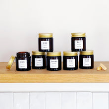 Load image into Gallery viewer, Set Of 7 Mini Amber Glass Jars With Gold Lids And White Labels