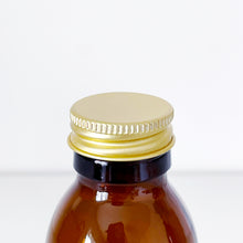Load image into Gallery viewer, Amber Glass Or Plastic Bottle With Gold Metal Screw Lid