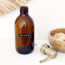 Load image into Gallery viewer, Amber Glass Or Plastic Dispenser Bottle With Stamped Personalised Label And Light Brushed Gold Metal Pump