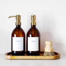 Load image into Gallery viewer, Set Of 2 Amber Bottles - Glass Or Plastic - Hands & Dishes - Brushed Light Gold Metal Pumps