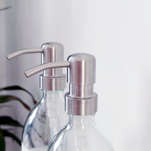 Load image into Gallery viewer, Set Of 2 Clear Bottles - Glass Or Plastic - Hands & Dishes - Silver Metal Pumps
