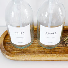 Load image into Gallery viewer, Set Of 2 Clear Bottles - Glass Or Plastic - Hands & Dishes - Brushed Light Gold Metal Pumps