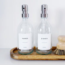 Load image into Gallery viewer, Set Of 2 Clear Bottles - Glass Or Plastic - Hands & Dishes - Silver Metal Pumps