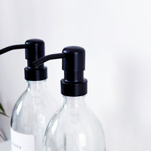 Load image into Gallery viewer, Set Of 2 Clear Bottles - Glass Or Plastic - Hands & Dishes - Black Metal Pumps