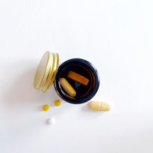 Load image into Gallery viewer, Set Of 7 Mini Amber Glass Jars With Gold Lids And White Labels