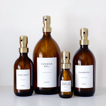 Load image into Gallery viewer, Amber Glass Or Plastic Dispenser Bottle With Personalised Label & Light Brushed Gold Metal Pump
