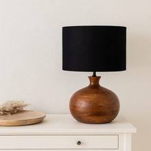 Load image into Gallery viewer, Kiah round dark mango wood table lamp base with black linen fabric drum shade. Perfect for a scandi interior.