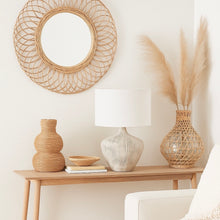 Load image into Gallery viewer, White washed ribbed wood table lamp base with a white linen shade on a side table in a boho living room with bamboo accessories.