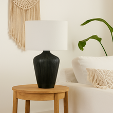 Load image into Gallery viewer, Tall black ribbed wooden lamp base with large white linen shade. Ideal for a minimalist bohemian interior.