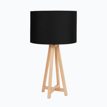 Load image into Gallery viewer, Whitby natural tapered table lamp base with a black linen shade on a bedside table.