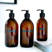 Load image into Gallery viewer, Amber Glass Or Plastic Dispenser Bottle With Stamped Personalised Label And Black Plastic Pump