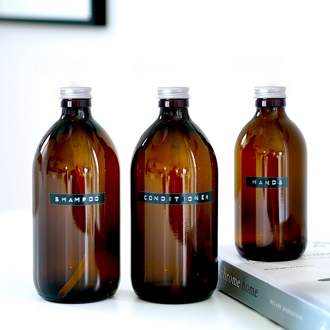 Amber Glass Or Plastic Bottle With Stamped Label & Silver Metal Screw Lid