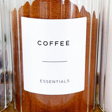 Load image into Gallery viewer, Glass jar of coffee with a label on a wooden surface
