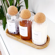 Load image into Gallery viewer, Three glass bottles labeled 'Tea', 'Coffee', and 'Sugar' with wooden lids on a wooden tray.
