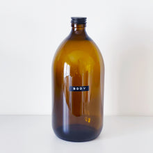 Load image into Gallery viewer, Amber Glass Or Plastic Bottle With Stamped Label &amp; Black Metal Screw Lid
