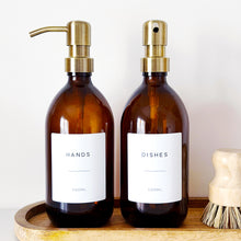 Load image into Gallery viewer, Set Of 2 Amber Bottles - Glass Or Plastic - Hands &amp; Dishes - Brushed Light Gold Metal Pumps
