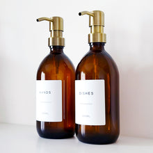 Load image into Gallery viewer, Set Of 2 Amber Bottles - Glass Or Plastic - Hands &amp; Dishes - Brushed Light Gold Metal Pumps
