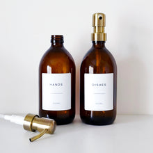 Load image into Gallery viewer, Set Of 2 Amber Bottles - Glass Or Plastic - Hands &amp; Dishes - Brushed Light Gold Metal Pumps
