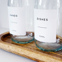 Load image into Gallery viewer, Set Of 2 Clear Bottles - Glass Or Plastic - Hands &amp; Dishes - Black Metal Pumps
