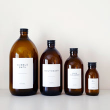 Load image into Gallery viewer, Amber Glass Or Plastic Bottle With White Label &amp; Black Metal Screw Lid
