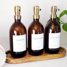 Load image into Gallery viewer, Set Of 3 Amber Bottles - Glass Or Plastic - Shampoo, Conditioner &amp; Body Wash - Brushed Gold Metal Pumps

