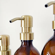 Load image into Gallery viewer, Amber Glass Or Plastic Dispenser Bottle With Personalised Label &amp; Light Brushed Gold Metal Pump
