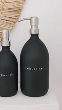 Load and play video in Gallery viewer, Matt Black Glass Dispenser Bottle With Stamped Personalised Label &amp; Silver Metal Pump
