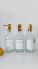 Load and play video in Gallery viewer, Set Of 3 Clear Bottles - Glass Or Plastic - Shampoo, Conditioner &amp; Body Wash - Gold Metal Pumps (Copy)
