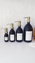 Load and play video in Gallery viewer, Matt Black Glass Dispenser Bottle With Personalised Label &amp; Light Brushed Gold Metal Pump
