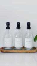 Load and play video in Gallery viewer, Set Of 3 Clear Bottles - Glass Or Plastic - Shampoo, Conditioner &amp; Body Wash - Black Metal Pumps
