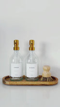 Load and play video in Gallery viewer, Set Of 2 Clear Bottles - Glass Or Plastic - Hands &amp; Dishes - Gold Metal Pumps
