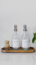 Load and play video in Gallery viewer, Set Of 2 Clear Bottles - Glass Or Plastic - Hand Soap &amp; Dish Soap - Silver Metal Pumps
