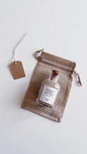 Load and play video in Gallery viewer, Personalised First Holiday Sand Bottle
