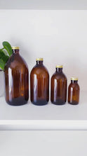 Load and play video in Gallery viewer, Amber Bottle With Gold Aluminium Screw Lid
