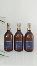 Load and play video in Gallery viewer, Set Of 3 Amber Bottles - Glass Or Plastic - Dark Blue Labels - Brushed Gold Metal Pumps
