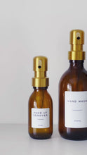 Load and play video in Gallery viewer, Amber Glass Or Plastic Dispenser Bottle With Personalised Label &amp; Gold Metal Pump
