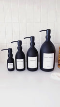 Load and play video in Gallery viewer, Matt Black Glass Dispenser Bottle With Personalised Label &amp; Black Metal Pump
