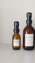 Load and play video in Gallery viewer, Amber Glass Or Plastic Dispenser Bottle With Personalised Label &amp; Black Metal Pump
