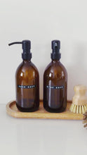 Load and play video in Gallery viewer, Set Of 2 Amber Bottles - Glass Or Plastic - Hand Soap &amp; Dish Soap - Black Metal Pumps
