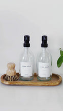 Load and play video in Gallery viewer, Set Of 2 Clear Bottles - Glass Or Plastic - Hand Soap &amp; Dish Soap - Black Metal Pumps
